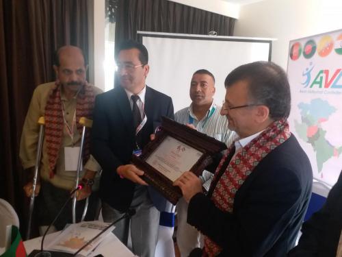 NVA General Secretary presenting Token of Love to Dr. Dawarzani