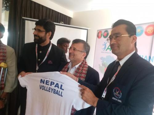 NVA General secretary presenting Tshirt to VFI general secretary