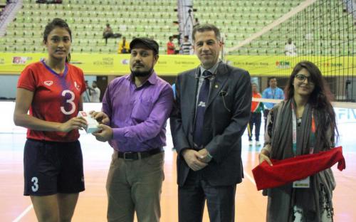 Women of the Match Saraswoti (red no 3)of Nepal against Maldives receive momento.